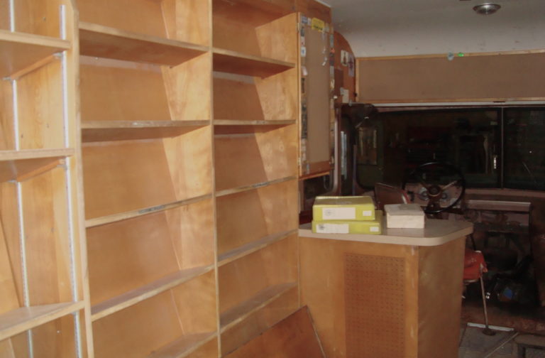 The interior of the Door County Bookmobile, including tilted shelves and the driver’s seat. Image courtesy of Julie Hein.