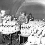 Inspecting pins coming off the Vulcan assembly line, 1954. Photograph courtesy of the Langlade County Historical Society.