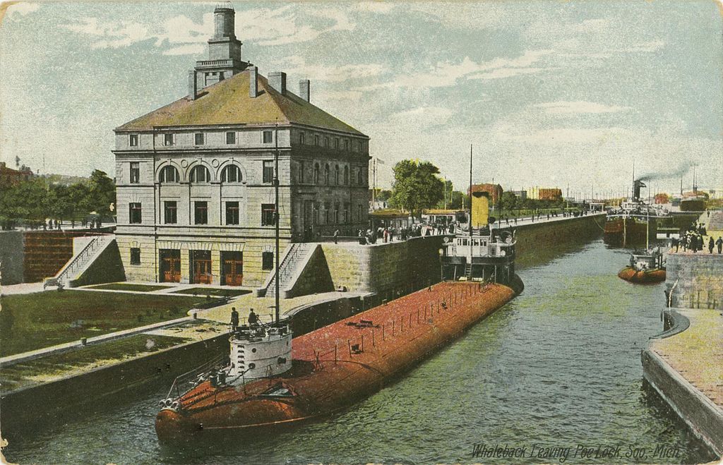 A whaleback ship navigating the locks in Sault Saint Marie