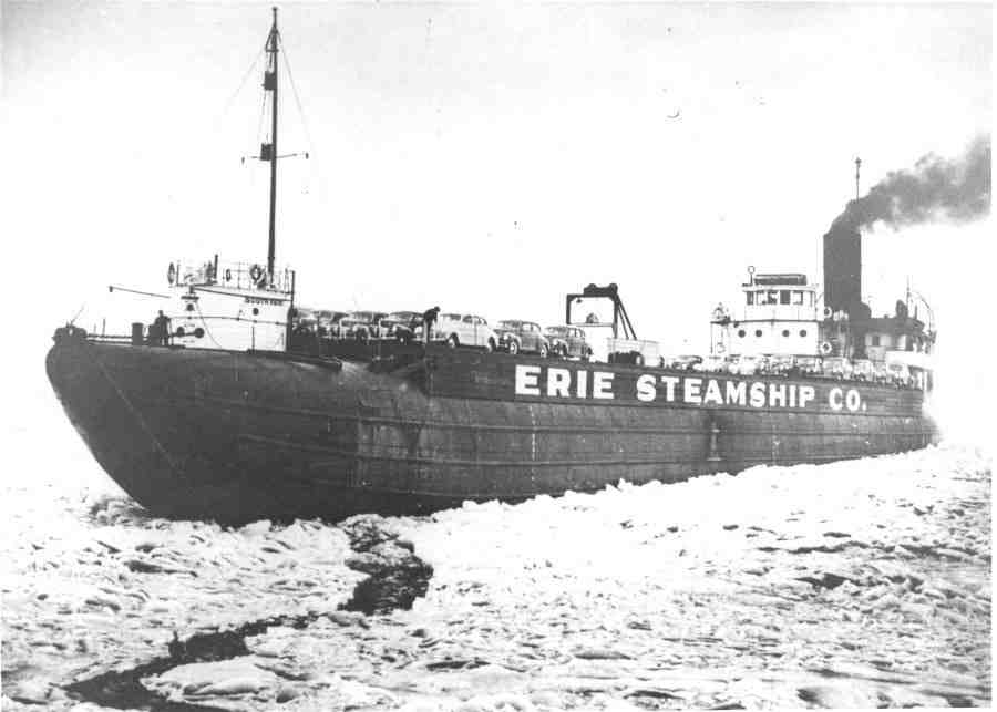 A black and white image of a whaleback ship in thick ice that has been converted to carry cars