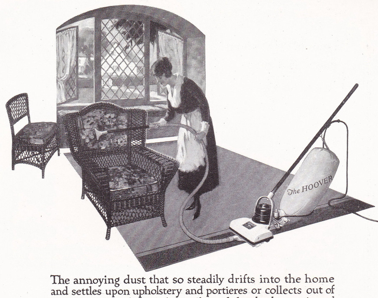 A black and white advertisement for an electric vacuum cleaner