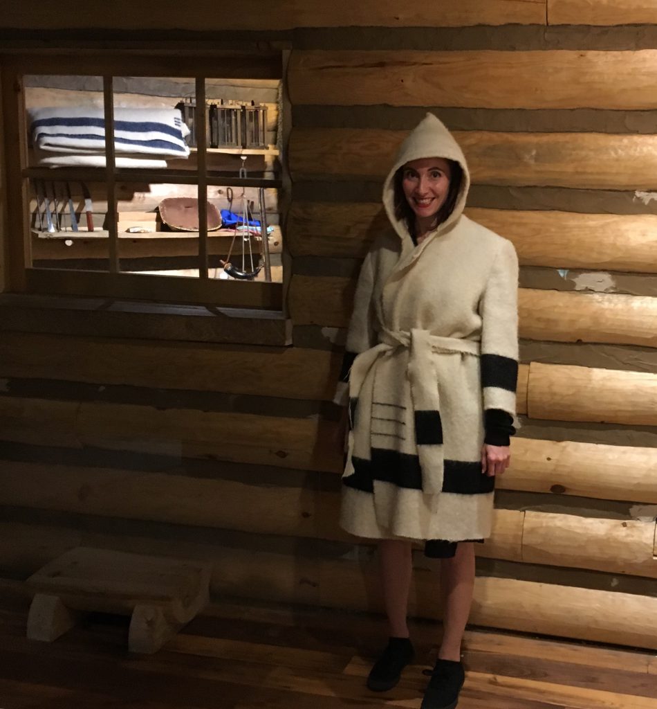 a person wearing a blanket coat