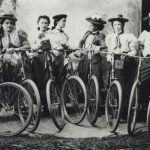 A group of women posing with bicycles