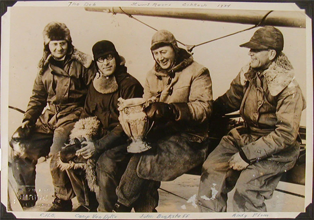 Carl Bernard sitting with three friends at the Stuart Cup race in Oshkosh, 1934