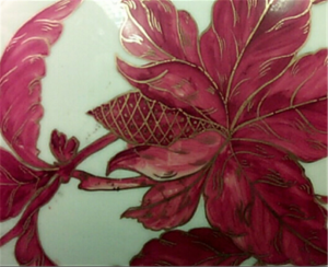 Hand-painted decoration on a porcelain pitcher during the American Art Pottery movement, 1880-1890